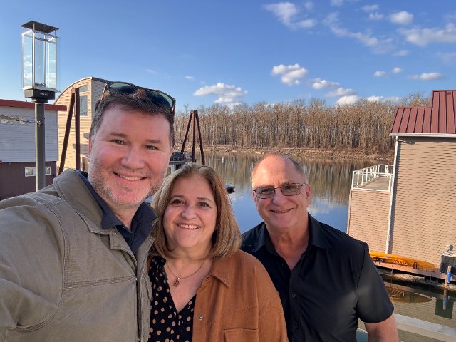 Andy with clients by the river