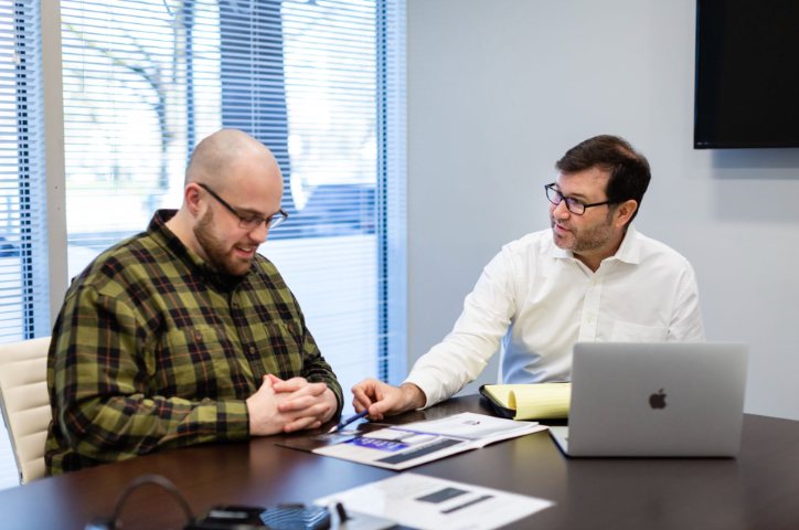Andy walking a client through the paperwork