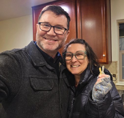 Andy with a client holding the keys to her new home
